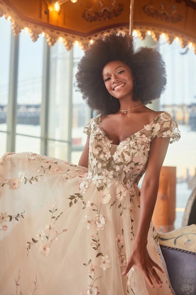 Model wearing white dress