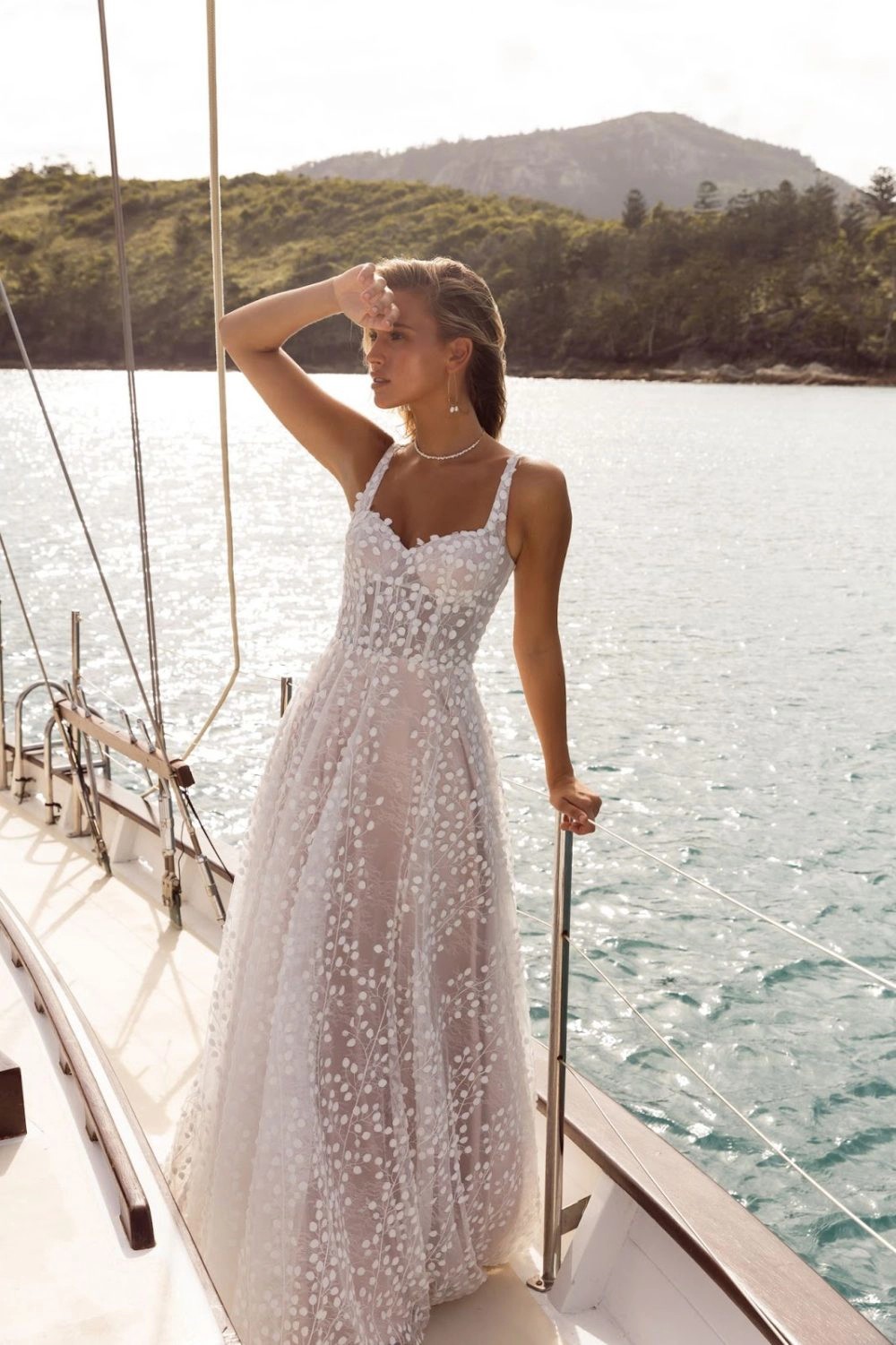 Model wearing white dress