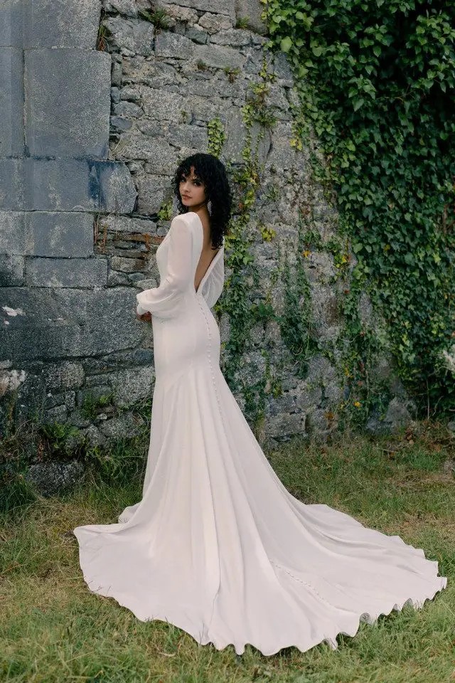 Model wearing white dress