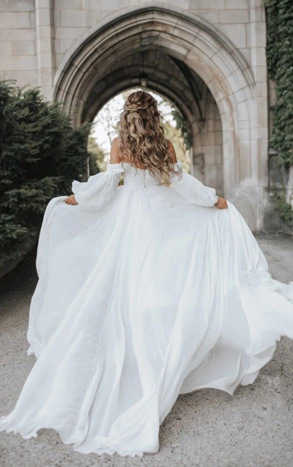 Model wearing white dress