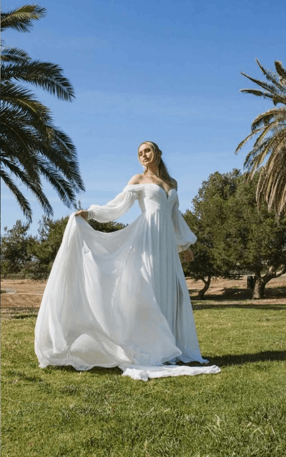 Model wearing white dress