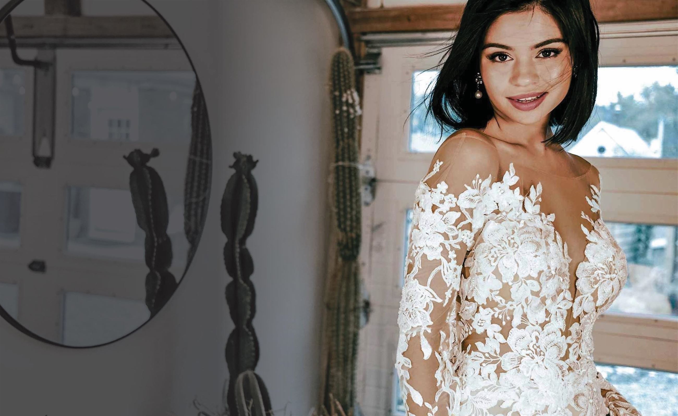 Model with short hair wearing an Essense of Australia wedding gown